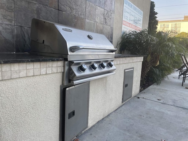 view of patio featuring a grill