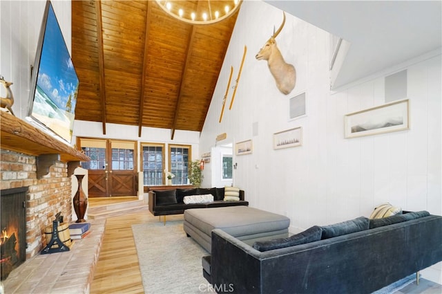 living room featuring high vaulted ceiling, a fireplace, wooden ceiling, wood-type flooring, and beam ceiling