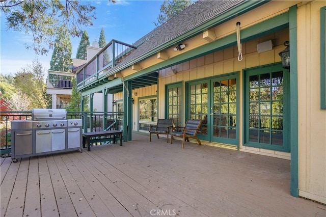 wooden deck featuring grilling area