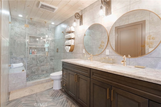 bathroom featuring vanity, an enclosed shower, backsplash, tile walls, and toilet