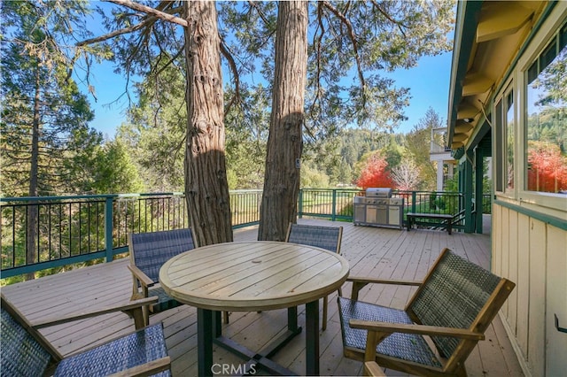 wooden terrace with grilling area