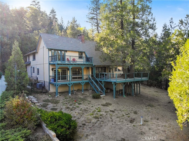 rear view of house with a deck