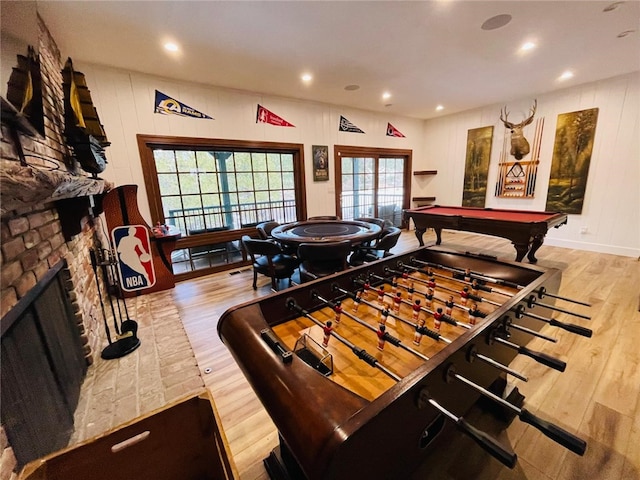 recreation room featuring light hardwood / wood-style flooring, pool table, and a wealth of natural light