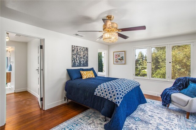 bedroom featuring ceiling fan and dark hardwood / wood-style flooring