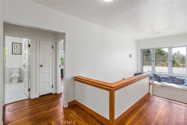 corridor featuring dark hardwood / wood-style floors