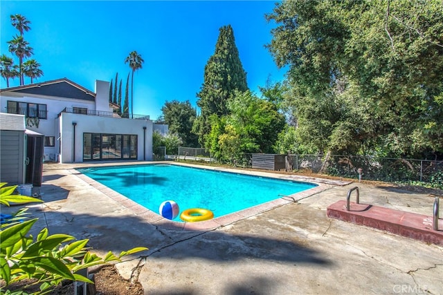 view of pool featuring a patio area