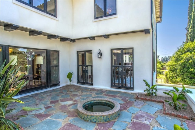 doorway to property featuring a patio