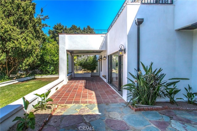 doorway to property with a patio area