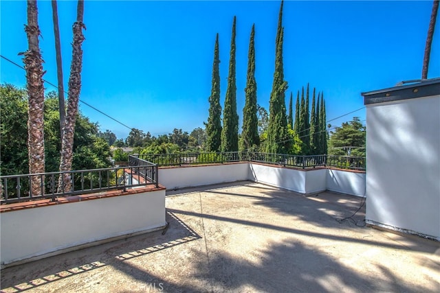 view of patio featuring a balcony