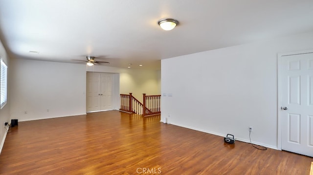 unfurnished room with ceiling fan and dark hardwood / wood-style floors