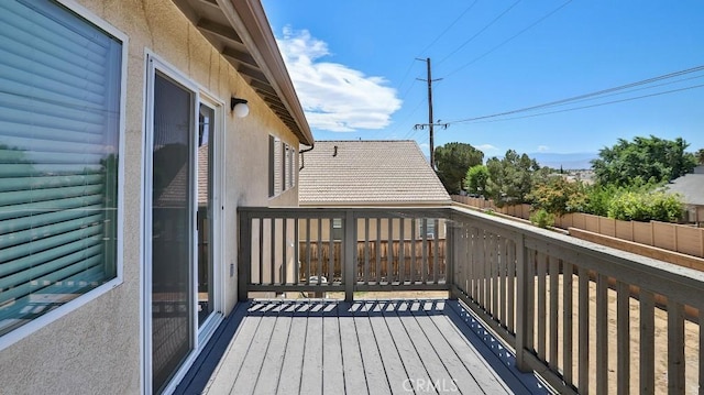 wooden deck featuring fence