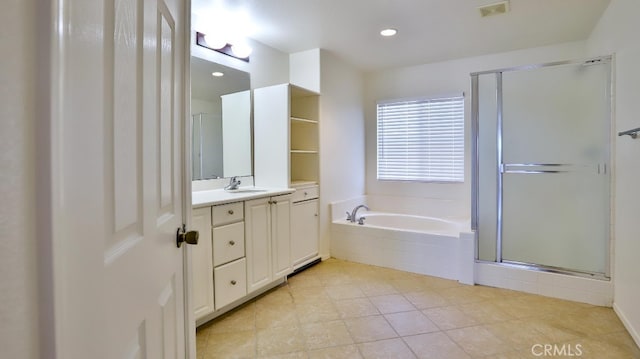 bathroom featuring vanity and plus walk in shower