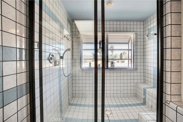 bathroom with tiled shower