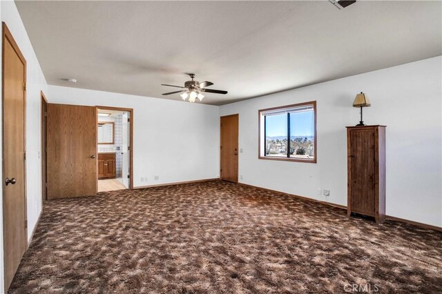 spare room featuring ceiling fan and light colored carpet