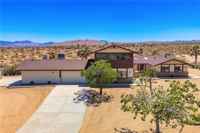 view of front of house featuring a mountain view and a garage