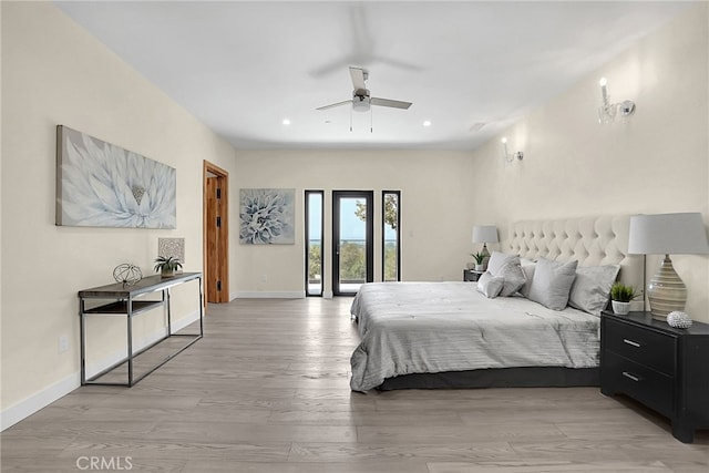 bedroom with ceiling fan, access to outside, and light hardwood / wood-style flooring