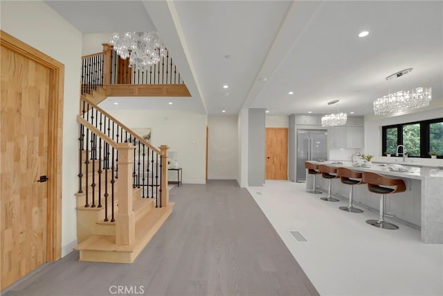 interior space featuring a chandelier and light wood-type flooring