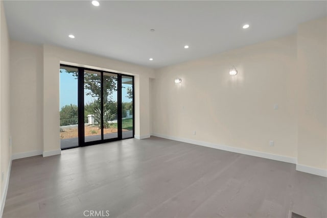 unfurnished room featuring light hardwood / wood-style flooring