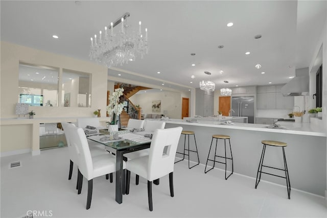 dining space with an inviting chandelier