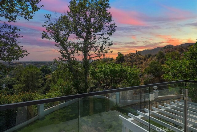 view of pool at dusk