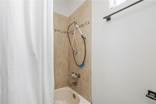 full bath featuring shower / tub combo with curtain