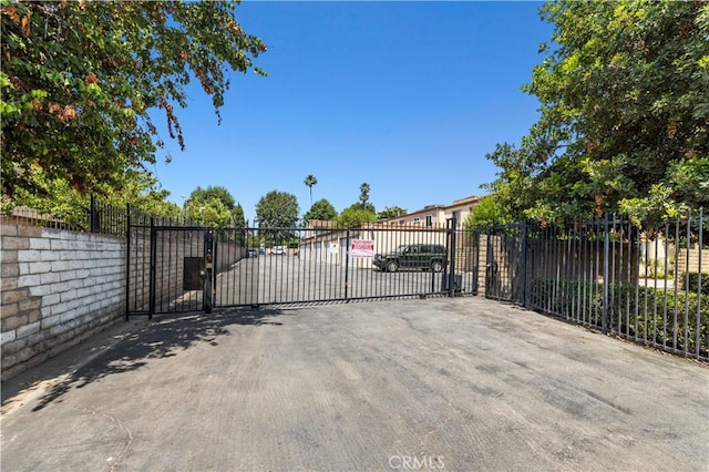 view of gate with fence