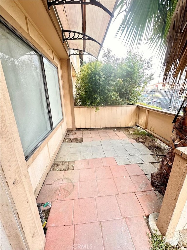 view of patio / terrace featuring fence