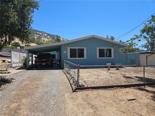 manufactured / mobile home with a mountain view and a carport