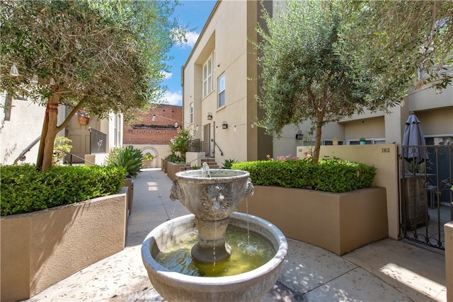 view of home's community with a patio area