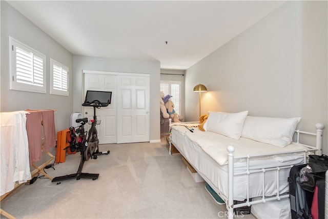 carpeted bedroom with a closet