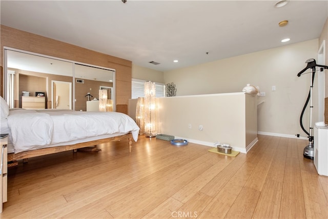 bedroom with light hardwood / wood-style floors