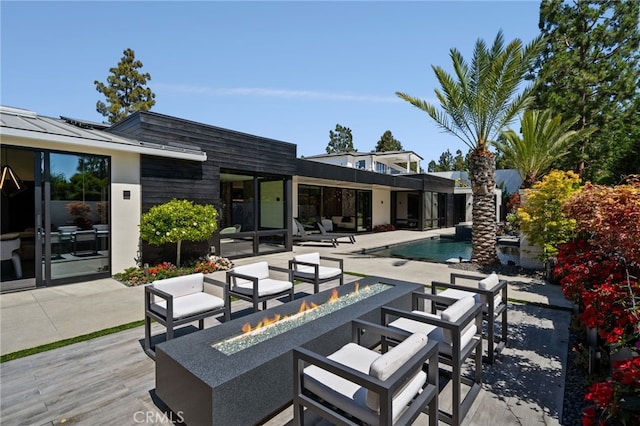 exterior space featuring an outdoor fire pit