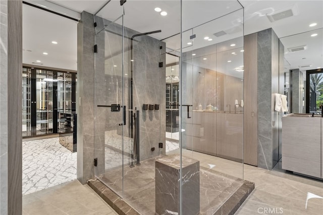 bathroom featuring a shower with door