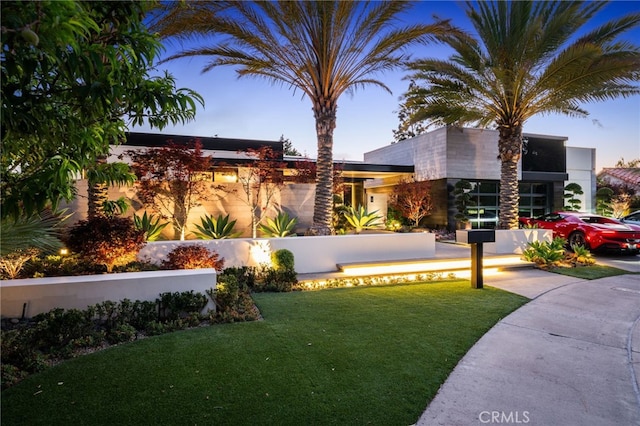 contemporary house featuring a yard