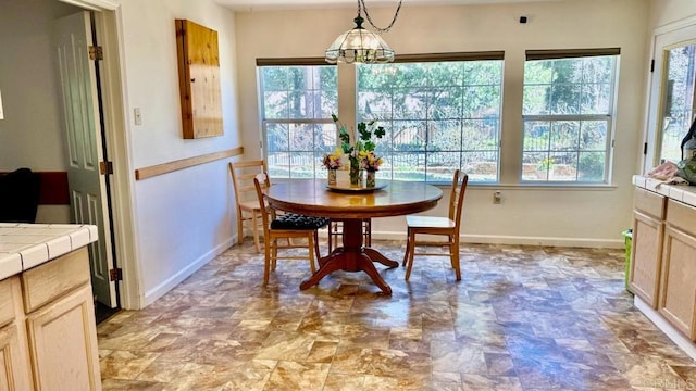 dining area featuring an inviting chandelier