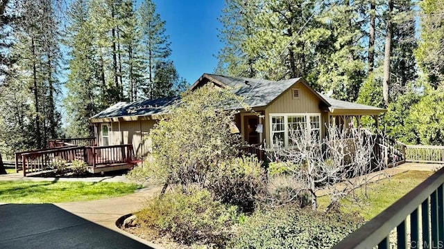 view of home's exterior featuring a deck