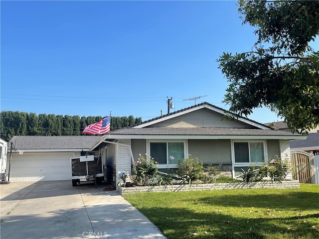 ranch-style home with a front lawn and a garage