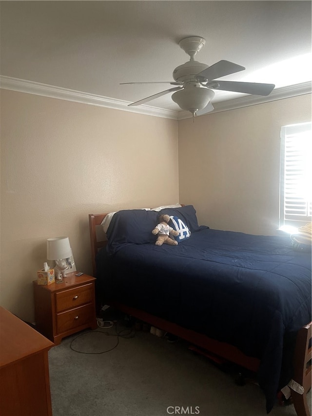 bedroom featuring ornamental molding, carpet, and ceiling fan