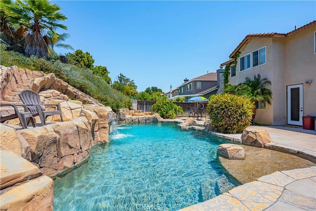 view of pool featuring a patio area and pool water feature