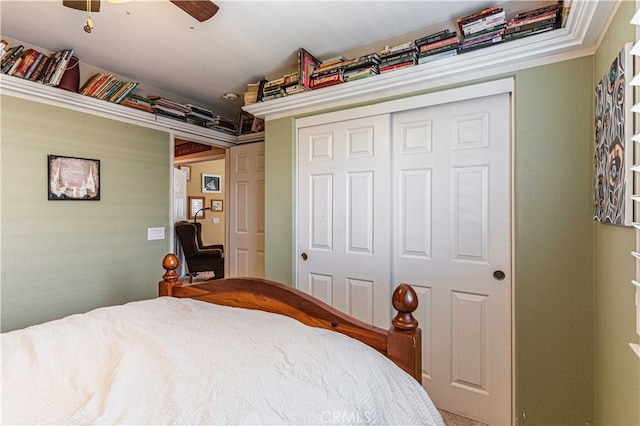 bedroom with ceiling fan and a closet