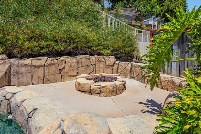 view of patio / terrace featuring an outdoor fire pit