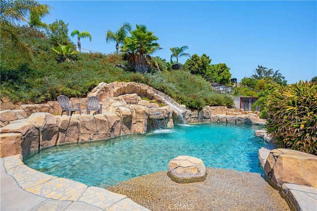 view of pool with pool water feature