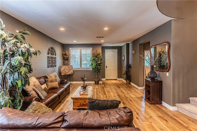 living room with light hardwood / wood-style floors