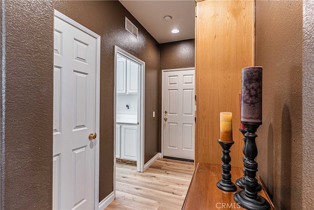 hallway featuring light wood-type flooring