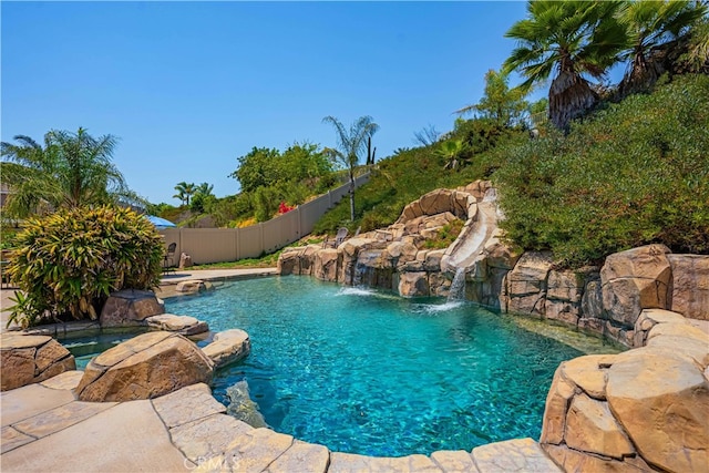 view of swimming pool featuring pool water feature