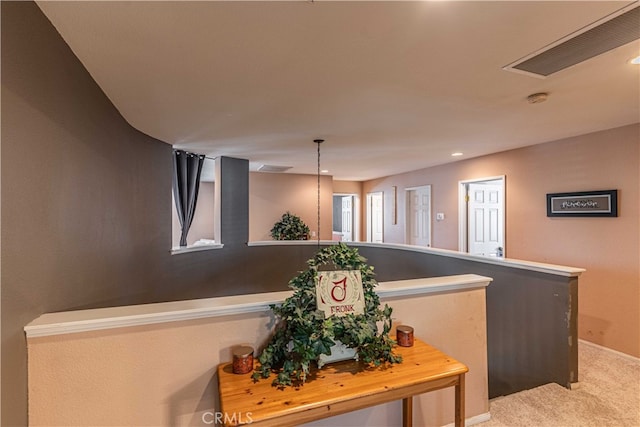 hallway featuring carpet floors