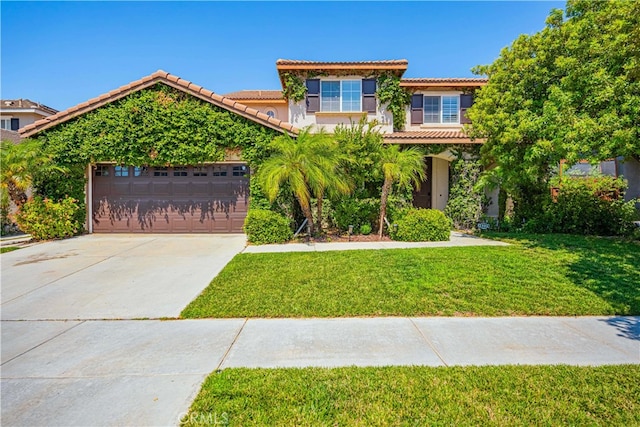 view of front facade featuring a garage and a front lawn