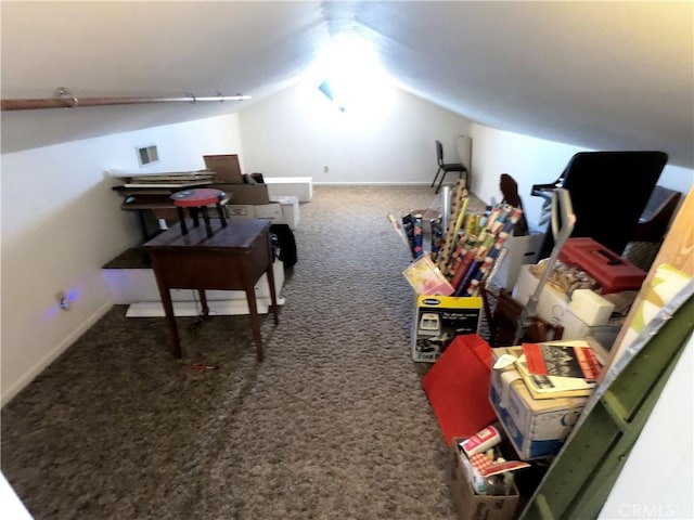 additional living space featuring carpet and lofted ceiling