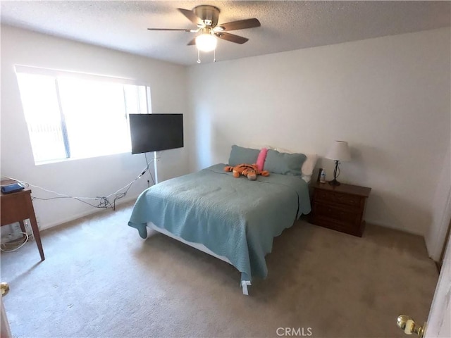 bedroom featuring carpet and ceiling fan