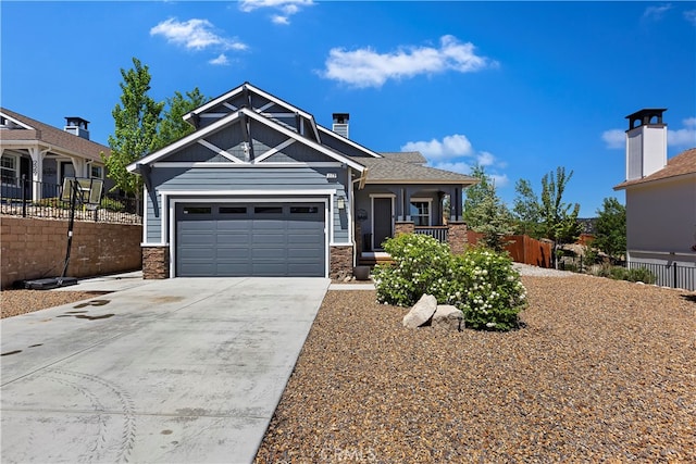 view of front of home with covered porch and a garage